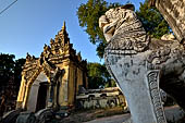 Myanmar - Inwa,  lions guarding enterance to Mahar Aung Mye Bon San Monastery 